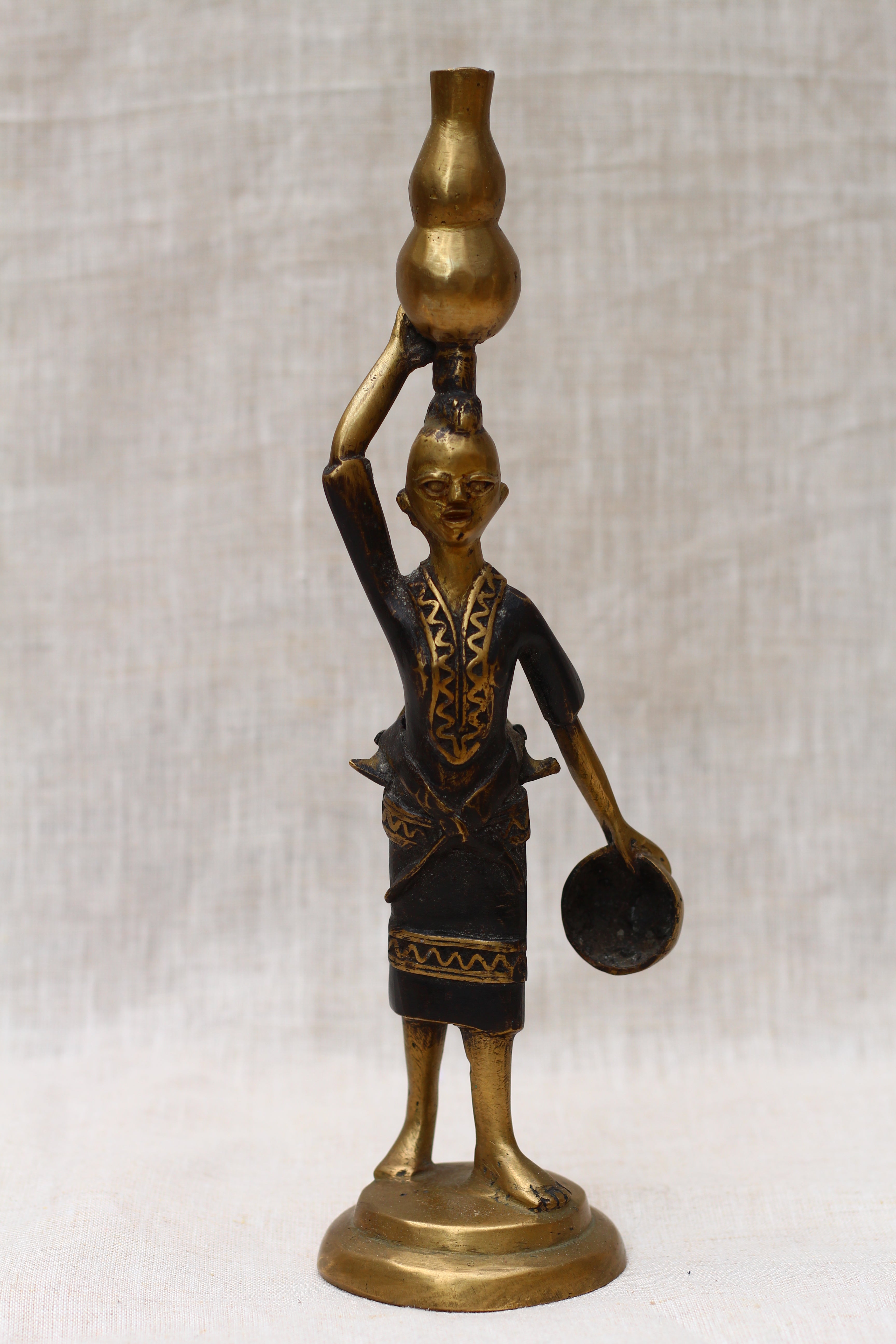 Lady Holding Vase Figurine