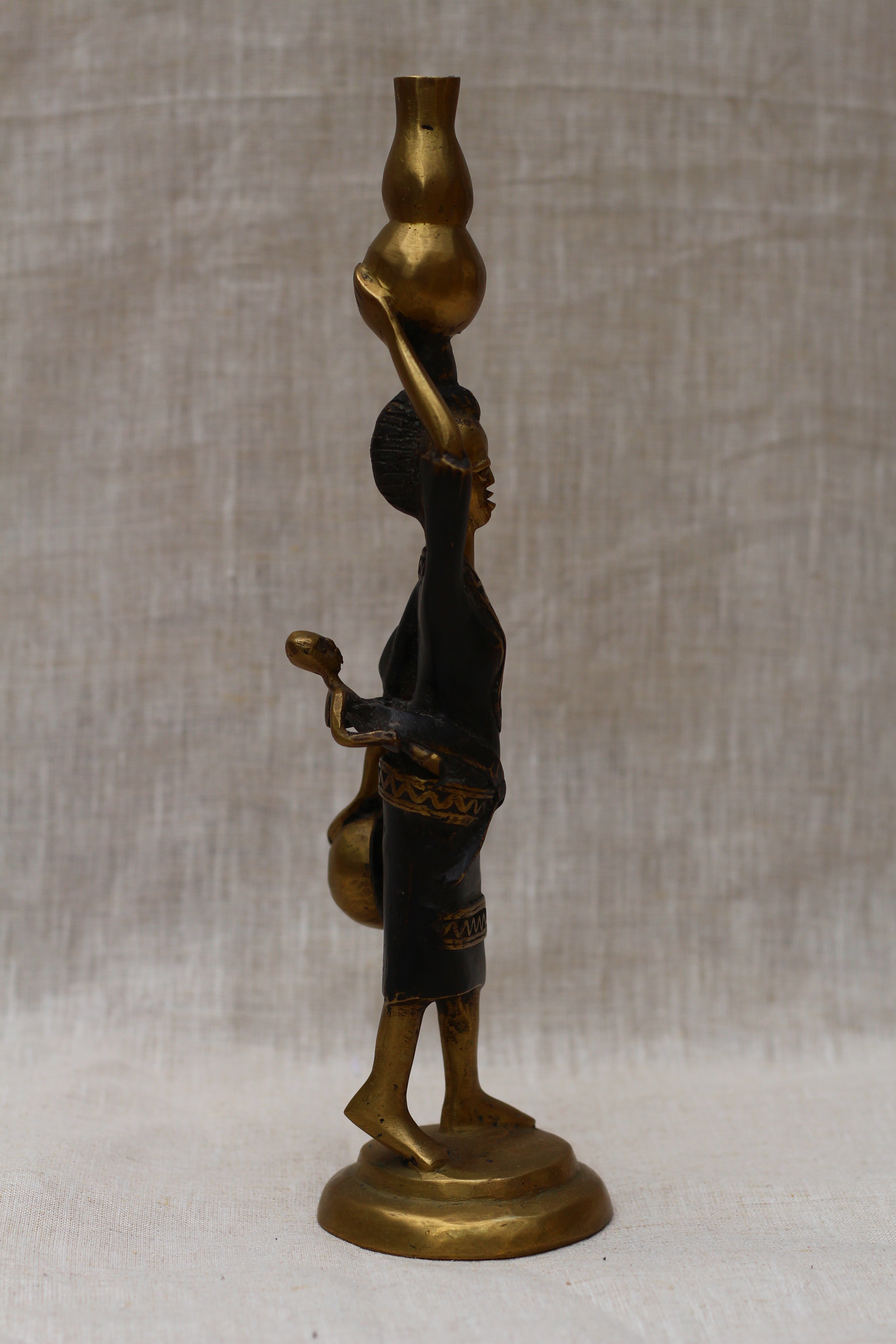 Lady Holding Vase Figurine